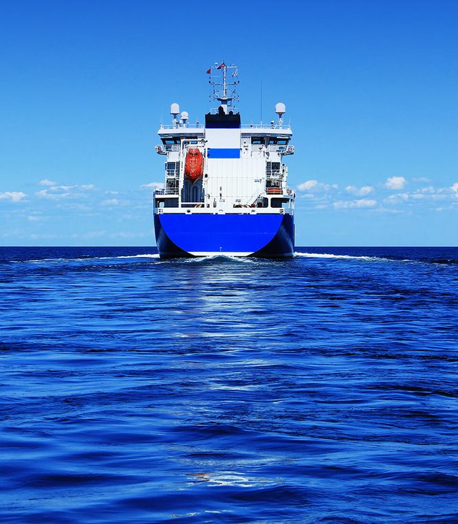 A large blue and white ship traveling in the ocean.